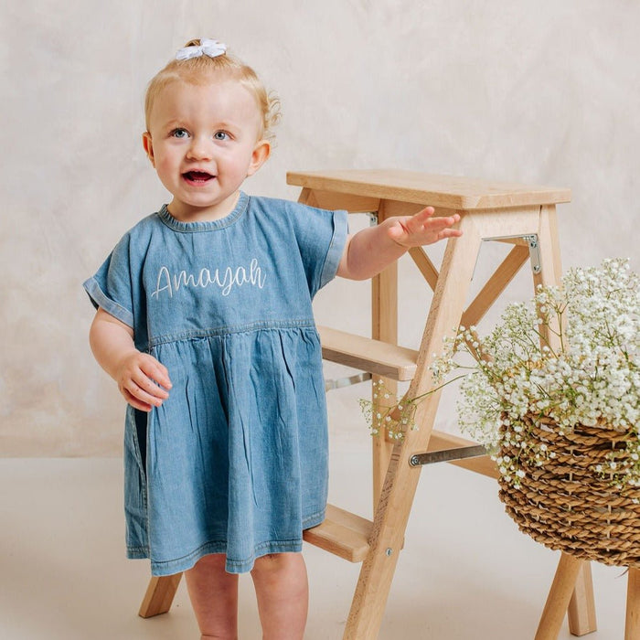 Personalised denim dress with embroidered 'Amayah' and pleated babydoll skirt