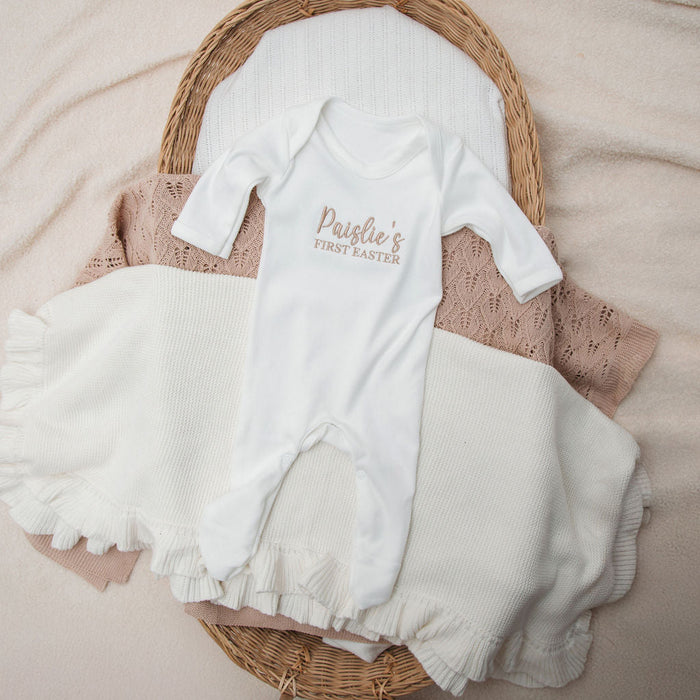 Personalised first Easter sleepsuit, white long-sleeve with 'Paislie's First Easter' print