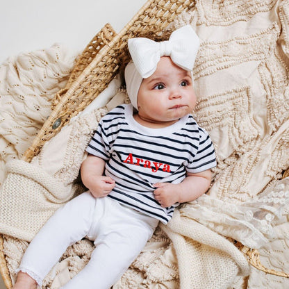 Striped baby T-shirt in navy and white with red 'Araya' print, crew neck