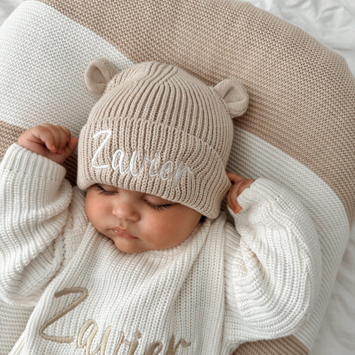 Personalised knitted teddy bear hat in beige/cream with bear ears and embroidered name
