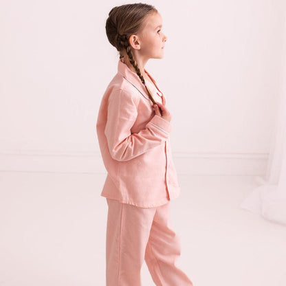 Pink embroidered pyjamas: side view of button-front shirt and trousers