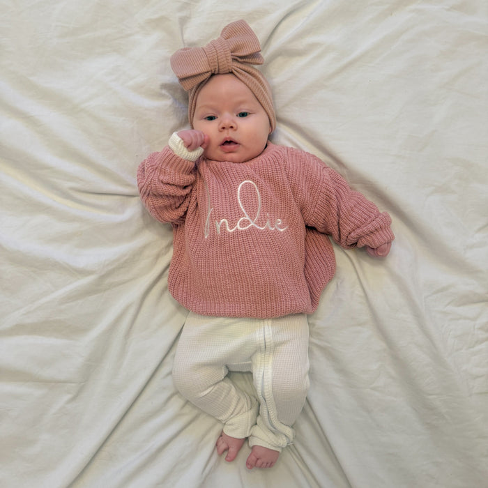 Personalised dusty pink knitted jumper with 'Indie' script and long sleeves