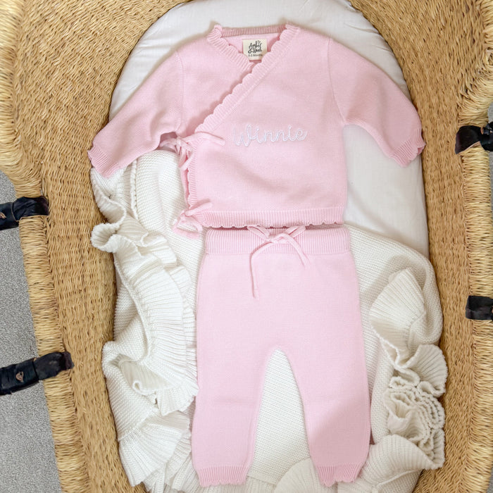 Pink baby kimono set, full front view of top and matching trousers with scalloped edges