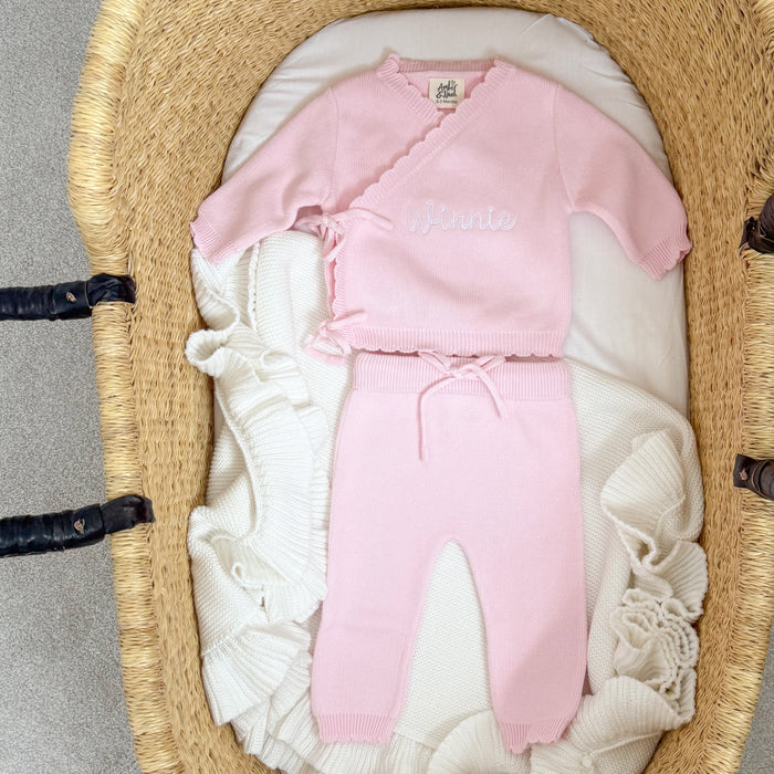 Pink baby kimono set in basket, embroidered text on top with matching cuffed pants