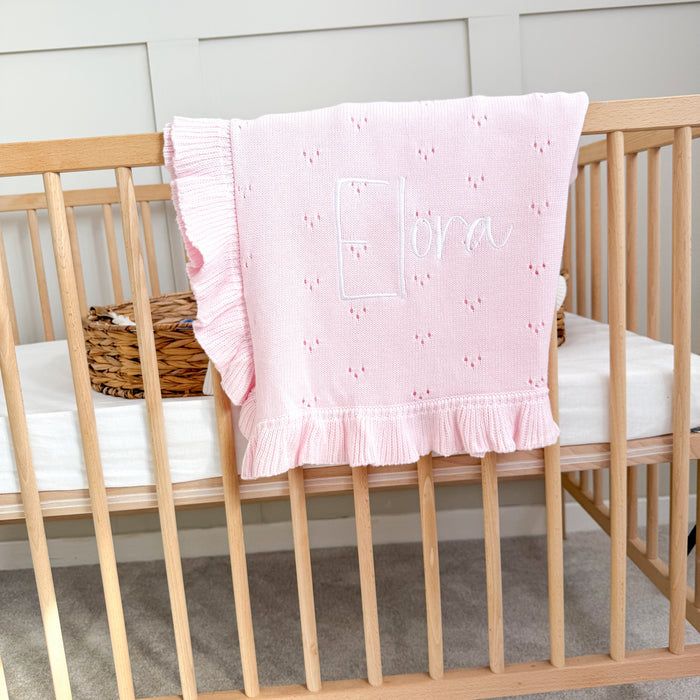 Pink pointelle blanket with ruffled side frill and personalised lettered design