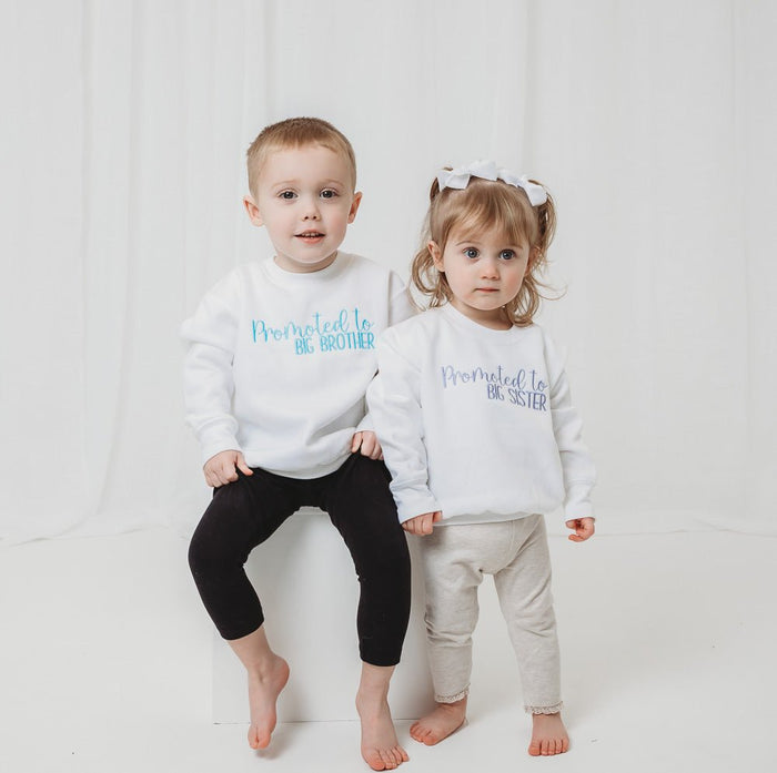 White pullover sweater for big sister with "Promoted to BIG SISTER" text