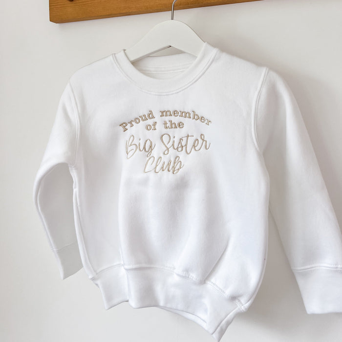 Children's white sweatshirt with printed text: Proud member of the Big Sister Club