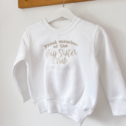Children's white sweatshirt with printed text: Proud member of the Big Sister Club