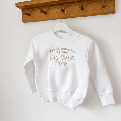 Children's white crewneck sweatshirt featuring 'Big Sister Club' printed design