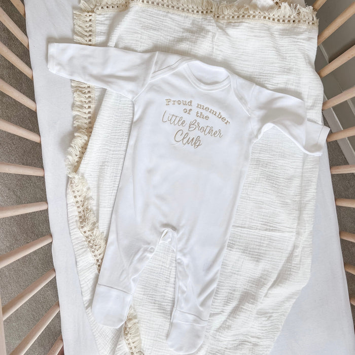 White baby long-sleeve romper with “Little Brother Club” front print