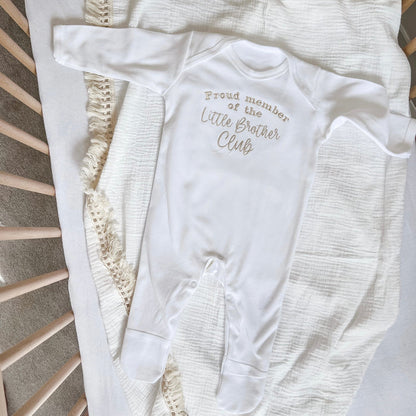 White baby long-sleeve romper with “Little Brother Club” front print and snaps