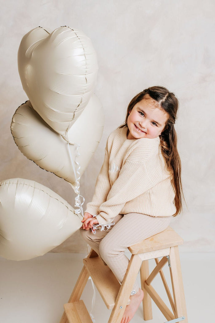 Beige knitted personalised jumper with crew neck and long sleeves, ribbed hem