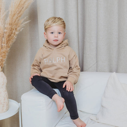 Tan kids embroidered hoody with bold RALPH lettering, front view
