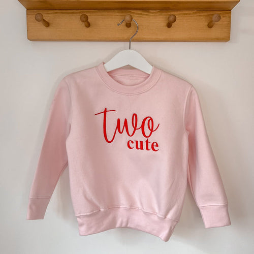 Pink sweatshirt with red 'Two cute' front print, crew neck and long sleeves
