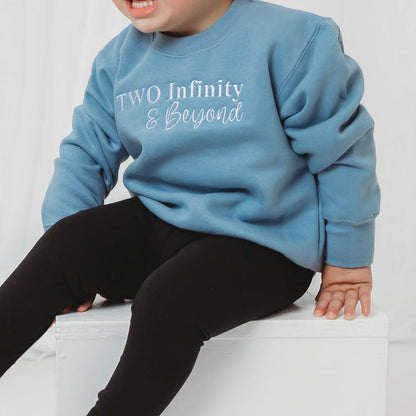 Light blue kids birthday sweater with 'Two Infinity & Beyond' front print, long sleeves