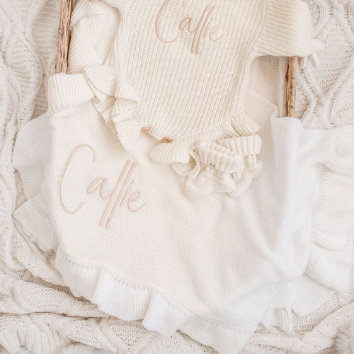 Personalized knit frill blanket with 'Callie' embroidery and scalloped ruffle trim