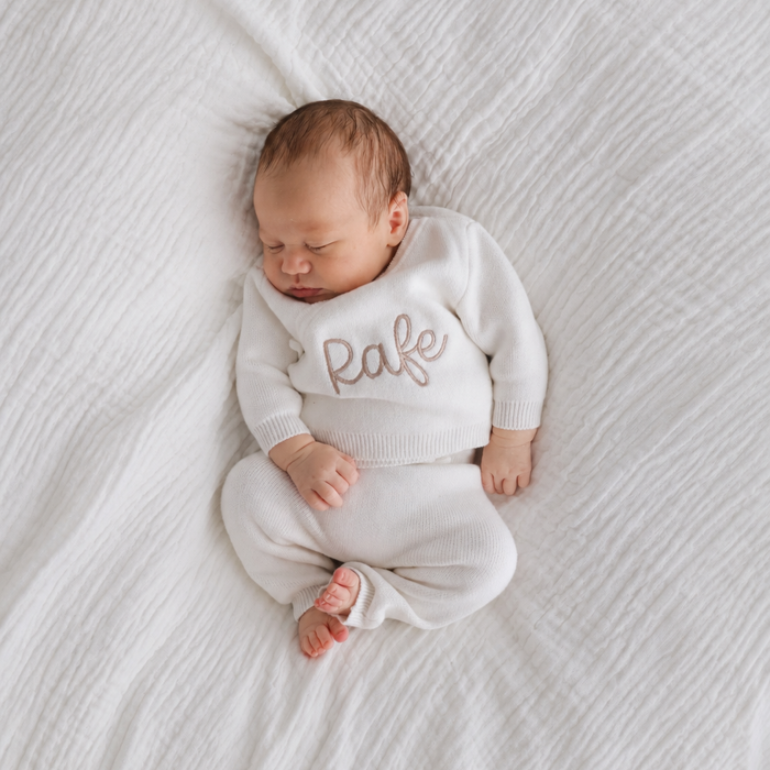 White baby kimono top and trousers set on newborn, Rafe name on chest