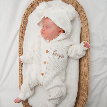 White baby romper with hood and long sleeves, button front, and name embroidery on chest