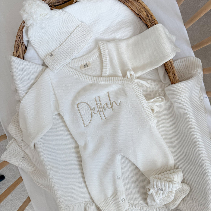 White long romper set with Delilah embroidery, long sleeves, and cuffed cuffs