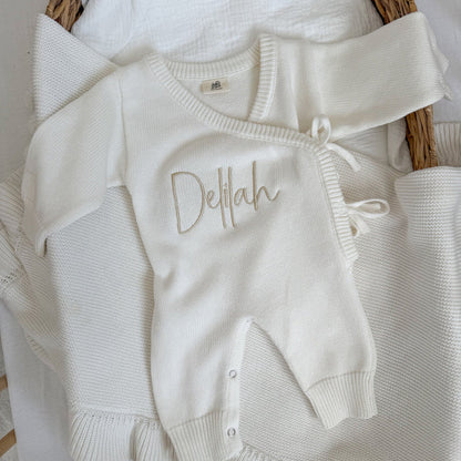 White long romper with Delilah name embroidery on the front bodice